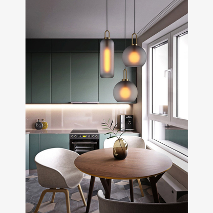 Globe and Capsule Glass Pendant Light with Brass Arch - Modern Style